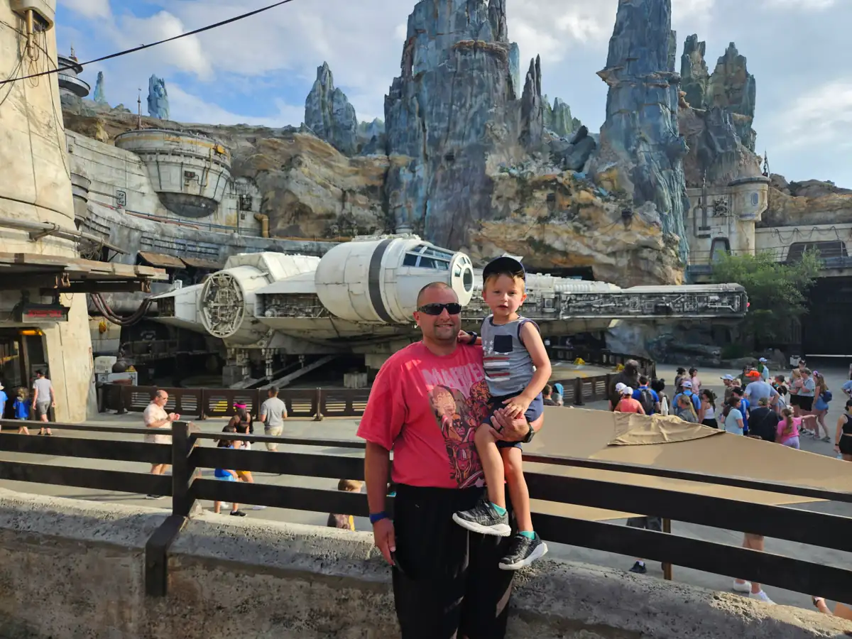 Sarah’s husband and child in front of the Millennium Falcon Sarah's husband and child in front of the Millennium Falcon